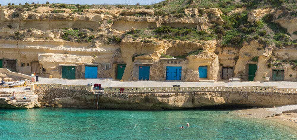 Boathouses on Shore of Gozo Island