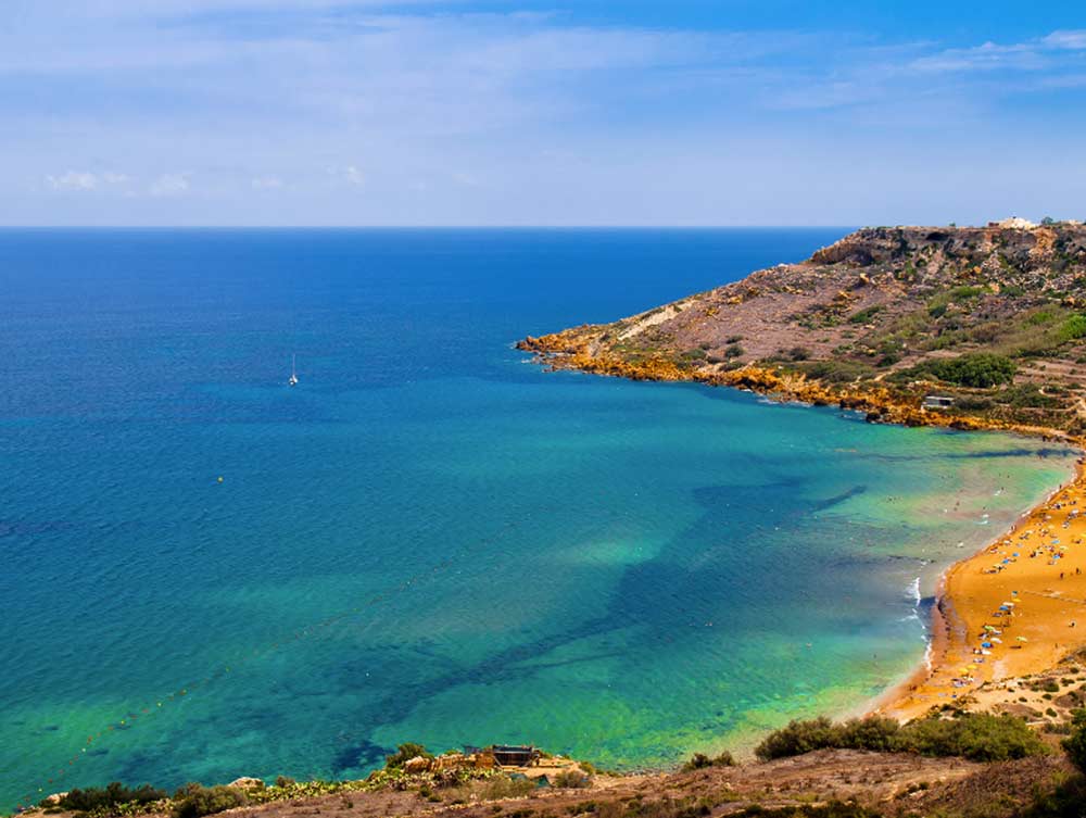 The colours of Ramla Bay on the Mediterranean island of Gozo. 